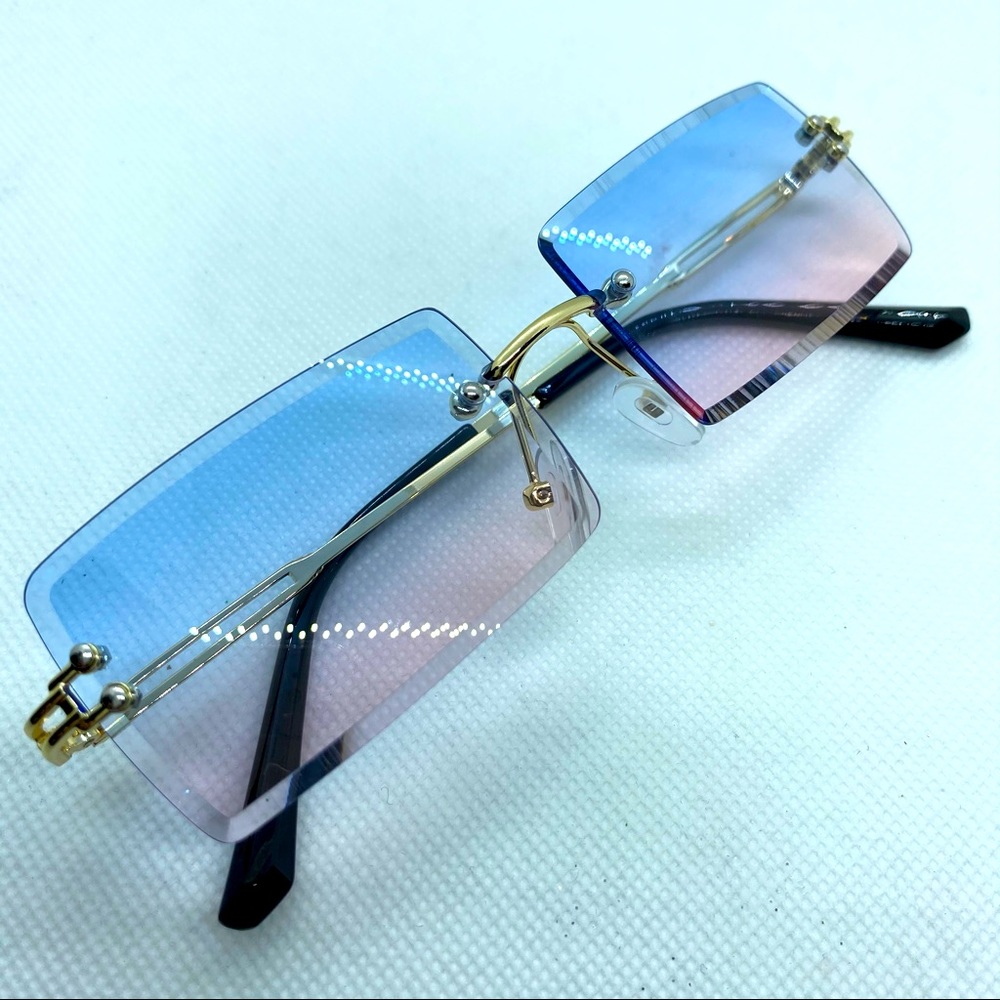 Women’s shades. Rimless. Blue to pink ombré rectangular frame.